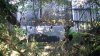Две трубы в забетонированной стене над отстойником