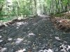Строящаяся дорога в районе кордона Бабук-Аул отсыпана свежим гравием добытым из реки Шахе