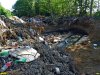Котлованы, вырытые для засыпки горящего мусора землей