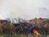 Сквозь дым  мусорного пожара видно микрорайон Юбилейный в Краснодаре