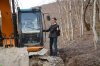 Строительная техника на в лесу, который уничтожает АО "Аксис инвестиции" 