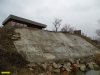 На отсыпанном мусором напротив проезда 5-й Обрывной участке незаконно построен дом и "берегоукрепление"