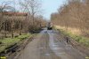 Разбитая большегрузами улица Яблоневая в СНТ "Урожай"