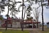 Несколько деверьев внутри здания с рестораном, кафе и магазином в сквере "Сосновая роща" (ст.Северская)