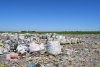 В больших пакетах - собранное на Северской свалке вторсырьё (бутылки)