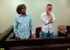 Андрей Рудомаха и Михаил Беньяш заслушивают решение о признании обыска 30.07.2019г. незаконным